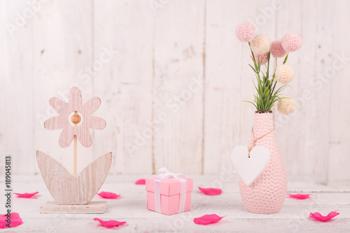 Flowers composition for Valentine's, Mother's or Women's Day. Pink flowers on old white wooden background.