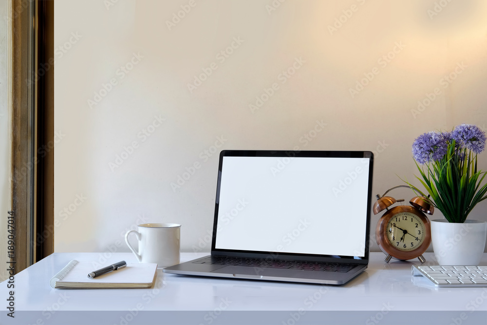Laptop computer with blank screen as copy space placed on home office desktop. Laptop computer with blank screen as copy space placed on home office desktop.