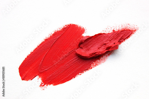 Smears of red lipstick close-up isolated on white background. Make-up, beauty.