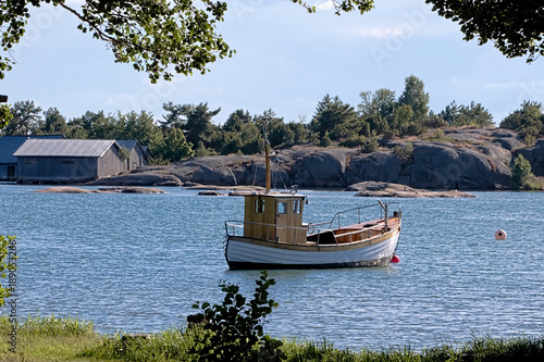 Old wooden boat in Karingsund, Aland archipelago photo