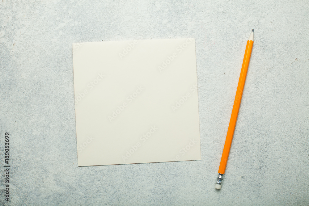 Beige square sheet of paper on a white background. Beige square sheet of paper on a white background.
