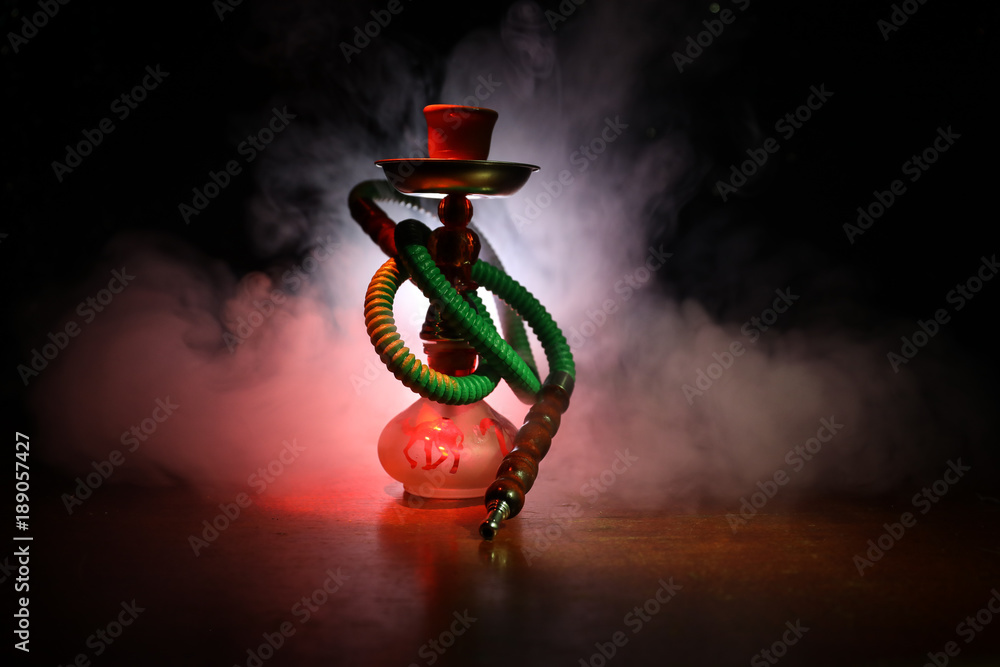 Hookah hot coals on shisha bowl with black background. Stylish oriental
