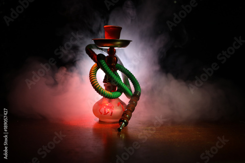 Hookah hot coals on shisha bowl with black background. Stylish oriental shisha. Shisha Concept. Selective focus photo