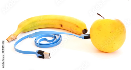 Banana and bright yellow apple connect blue usb charge cable. Isolated. White background