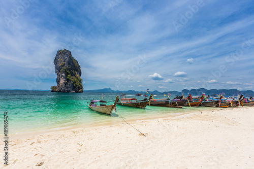 Railay beach with colorful long tail boats in Krabi, Thailand in beautiful sky day © kanonsky