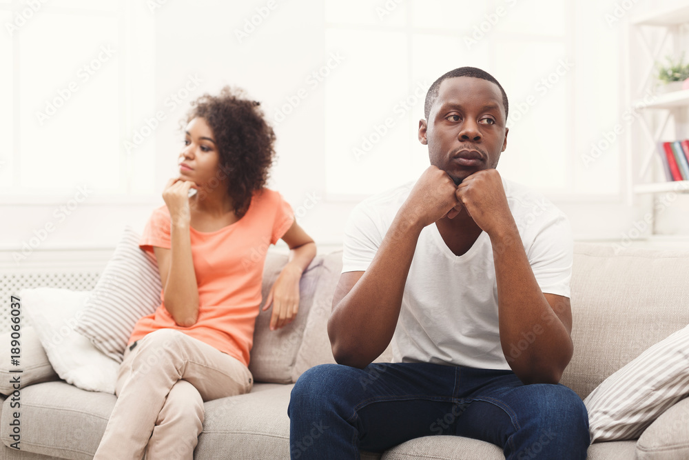 Young black couple quarreling at home Young black couple quarreling at home
