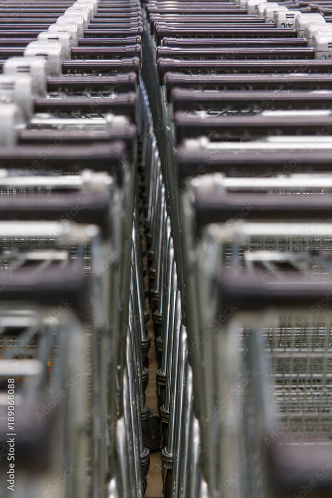 Many empty shopping carts in a row. Many empty shopping carts in a row.