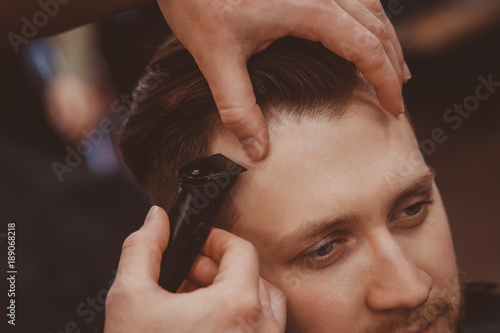 Barbershop. Hairdressers Barber hair and beard with razor in hair salon