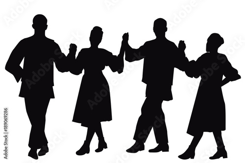 Silhouettes of folk dancers