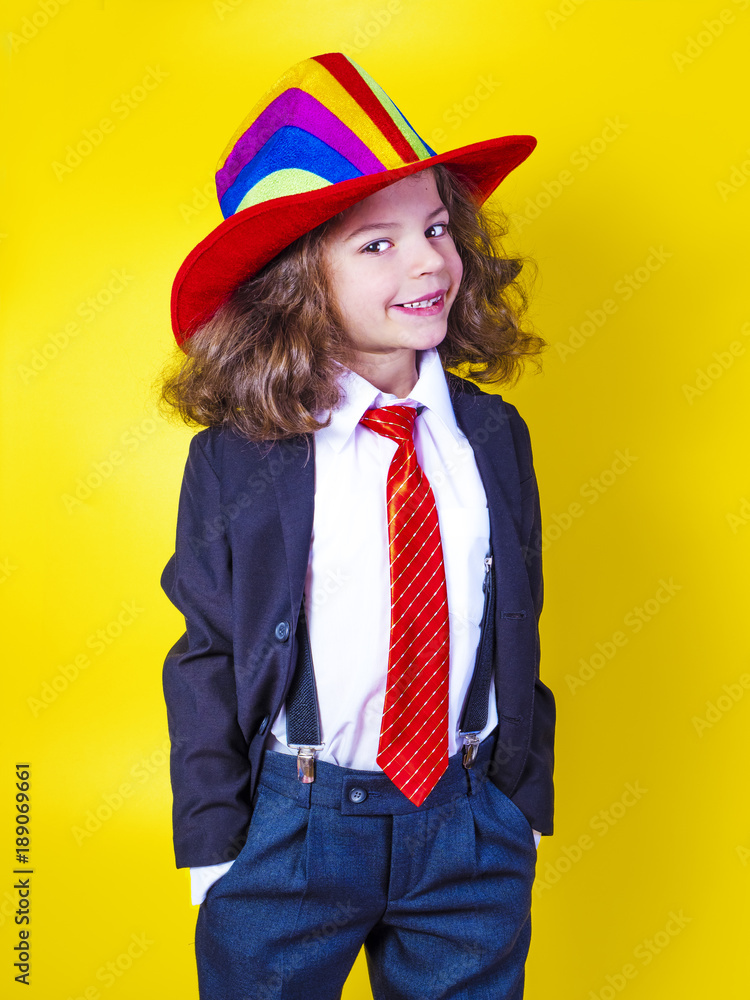 Portrait of a smiling little boy in a big American hat and shirt. Happy child. Portrait of a smiling little boy in a big American hat and shirt. Happy child.