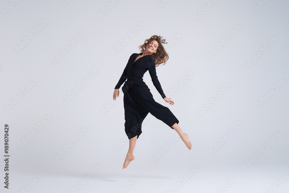 Cheerful young woman hovering in the air