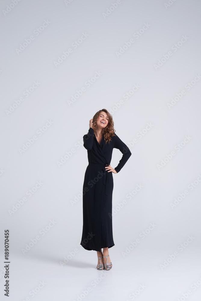 Candid trendy young model posing at camera in studio Candid trendy young model posing at camera in studio