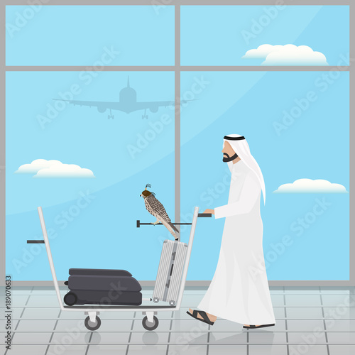 Arab with a falcon on a trolley at the airport