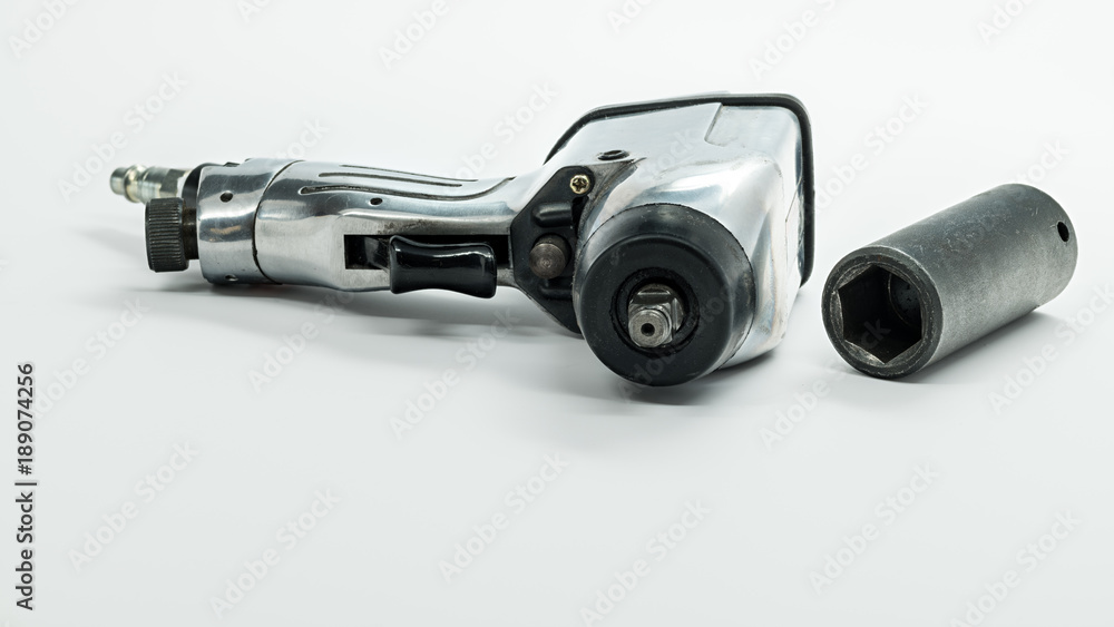 Mechanics air wrench and socked used for removing wheels form a car Mechanics air wrench and socked used for removing wheels form a car