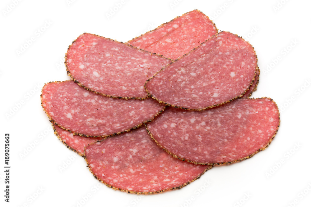 Salami slices isolated on the white background. Salami slices isolated on the white background.