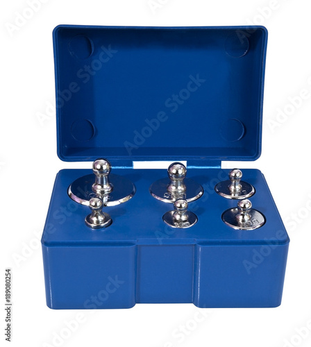 Steel calibration weights in blue plastic box. Isolated.