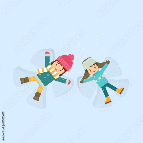 Girl and boy making a snow angel