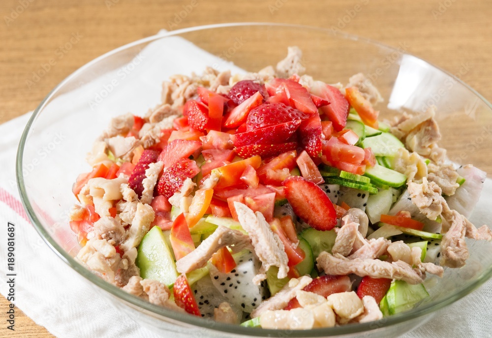Glass Bowl of Delicious Chicken Salad with Fruits