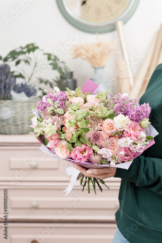 Wallpaper Mural beautiful luxury bouquet of mixed flowers in woman hand. the work of the florist at a flower shop. cute lovely girl Torontodigital.ca