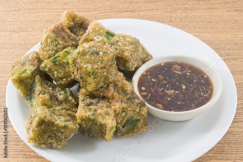 Fried Steamed Garlic Chives Dumpling Served with Spicy Soy Sauce photo