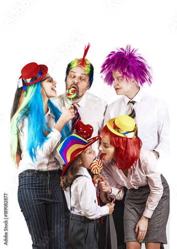 Father and children celebrate carnival, isolated on white