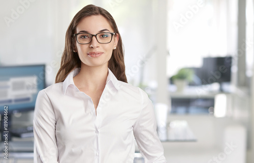 Confident young professional business woman portrait Free Download Confident young professional business woman portrait - GFXLoad