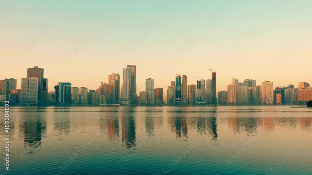 Panning along coast of Khalid lake. Skyline with skyscrapers. Al Noor island in Sharjah, UAE. Panning along coast of Khalid lake. Skyline with skyscrapers. Al Noor island in Sharjah, UAE.