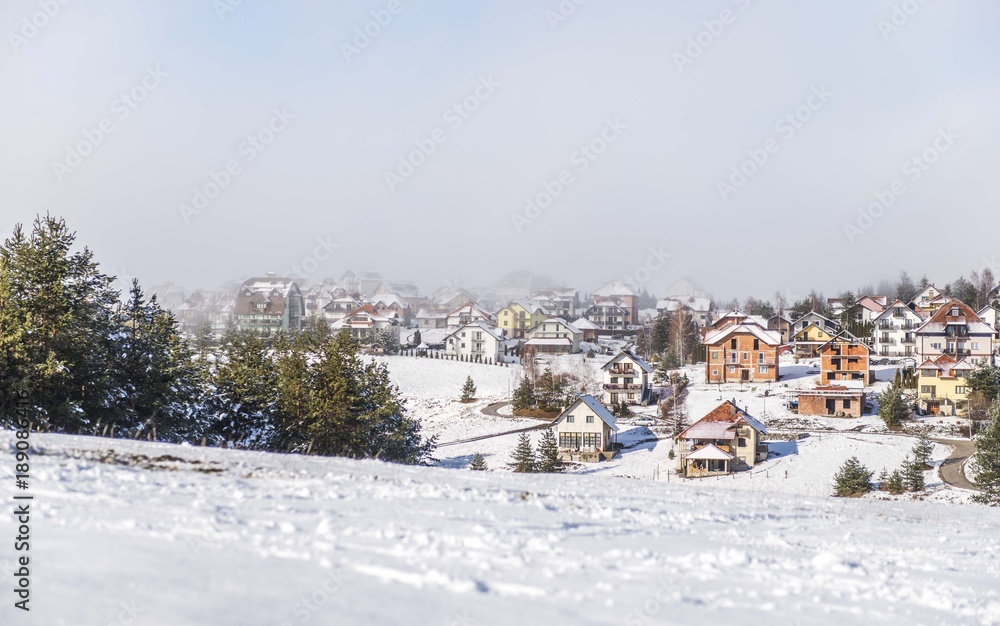 snow mountain landscape with house buildings 