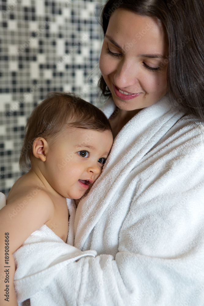 mother in a Bathrobe and with a child mother in a Bathrobe and with a child