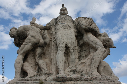 One of the statues at famous Ponte Vittorio Emanuele 2 in Rome, Italy.