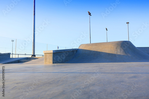 skate park generic concrete ramps outside with blue sky