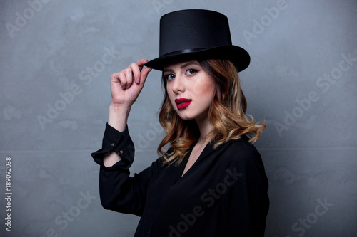 woman in black dress and top hat © Masson
