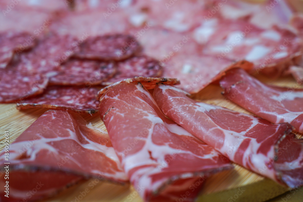 Food tray with delicious salami and ham. Meal platter with selection Food tray with delicious salami and ham. Meal platter with selection