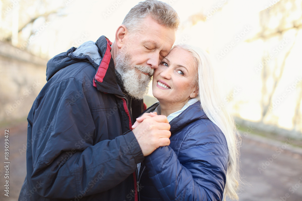 Fototapeta premium Portrait of happy mature couple outdoors
