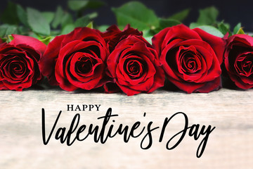 Happy Valentine's Day Typography with Roses in a Line on Rustic Wooden Background