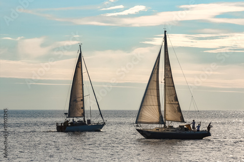 Sailboats traveling by Baltic sea