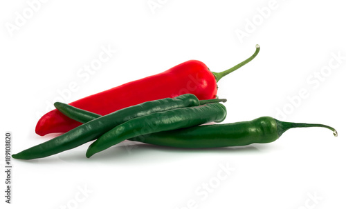 Green chili pepper and red pepper isolated on black background cutout