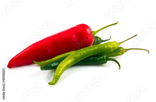 Green chili pepper and red pepper isolated on black background cutout
