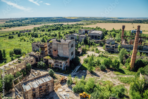 Aerial view to old abandoned industrial  buildings. Abandoned cement and reinforced concrete factory