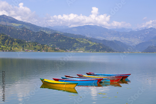 Lake Phewa, wooden boat in Pokhara, Nepal, with the Himalayan mountains in the background