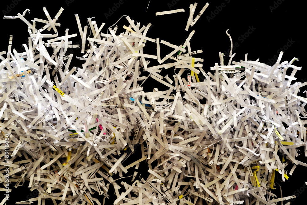 Shredded paper on black background Shredded paper on black background