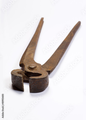 Old, rusty pliers for pulling out nails on a white background