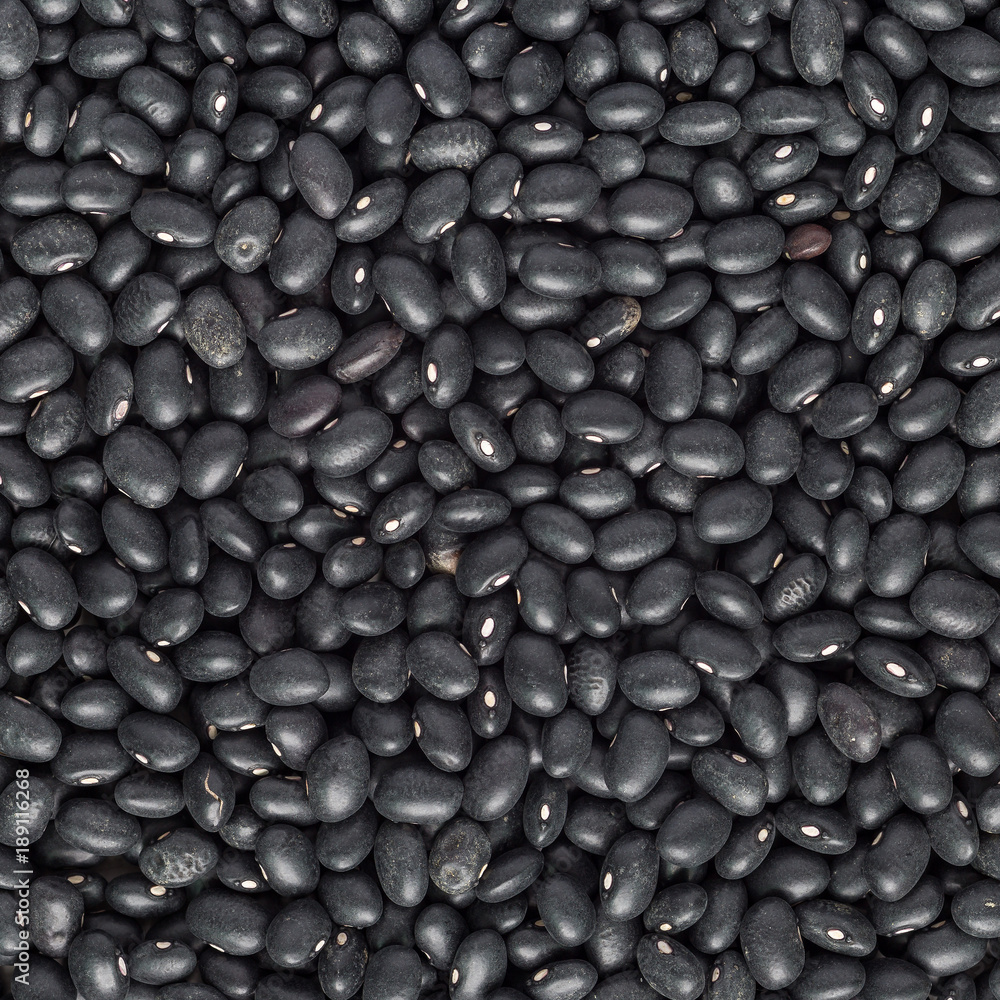 Food background with uncooked dry black beans, top view, square Food background with uncooked dry black beans, top view, square