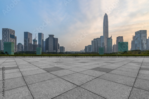 Panoramic skyline and buildings with empty square floor. © hallojulie
