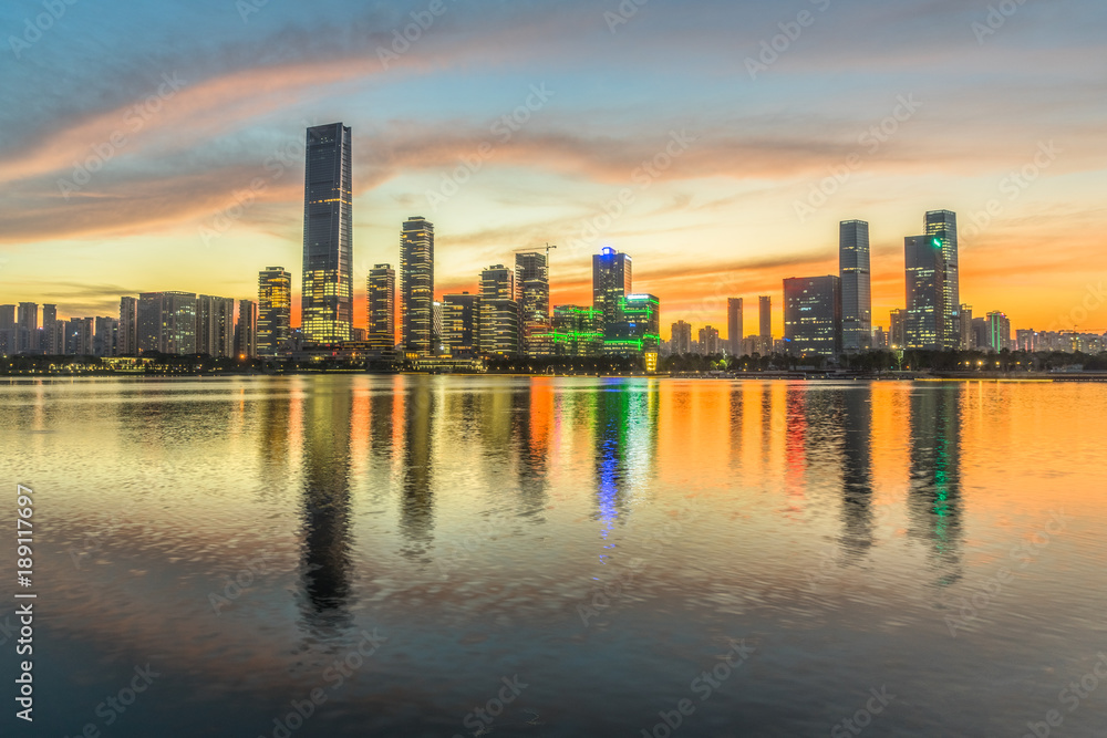 modern city waterfront downtown skyline under colorful dramatic sky,China