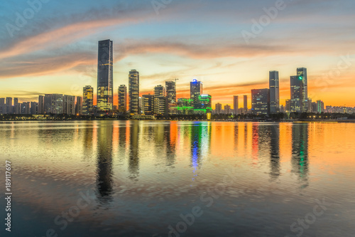 modern city waterfront downtown skyline under colorful dramatic sky,China © hallojulie