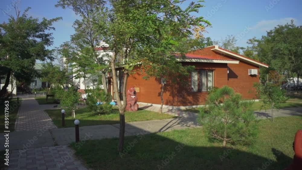 Wooden house on summer vacation at sunset rapid slow motion Wooden house on summer vacation at sunset rapid slow motion