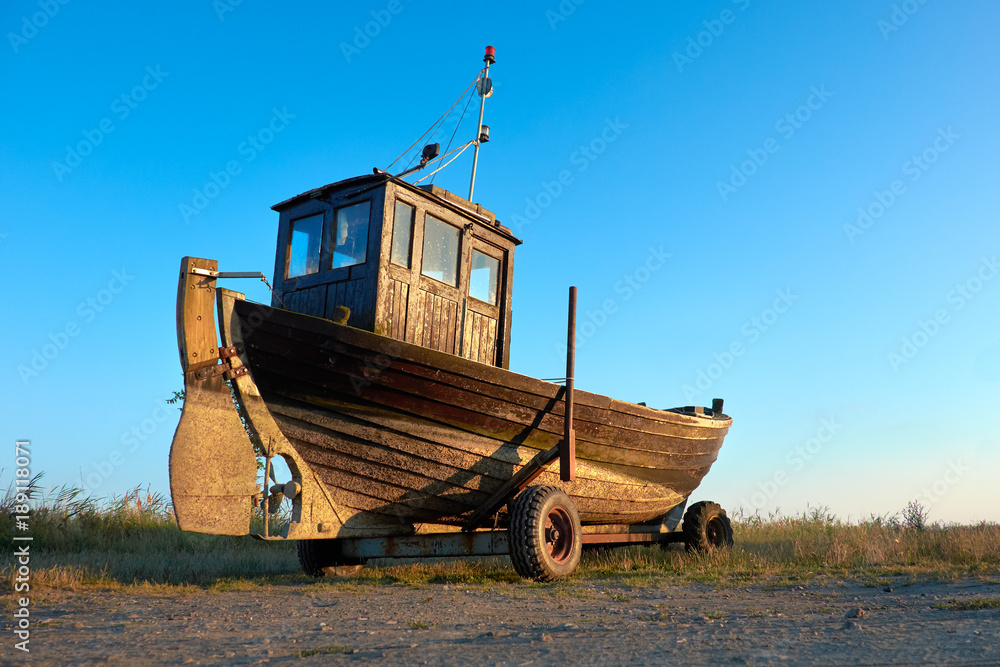 Fototapeta premium Traditional German fisherman boat on a seashore of Baltic Sea on island Rugen