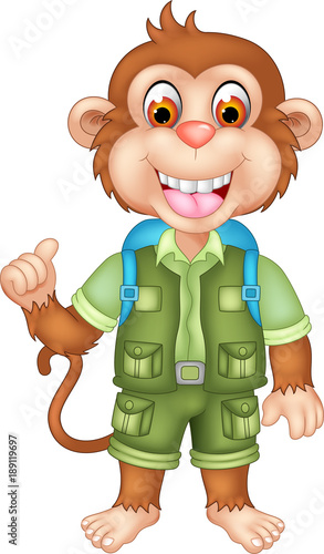 cute monkey cartoon standing with laughing and thumb up photo