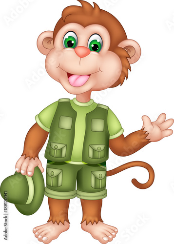 cute monkey cartoon standing bring hat with waving photo